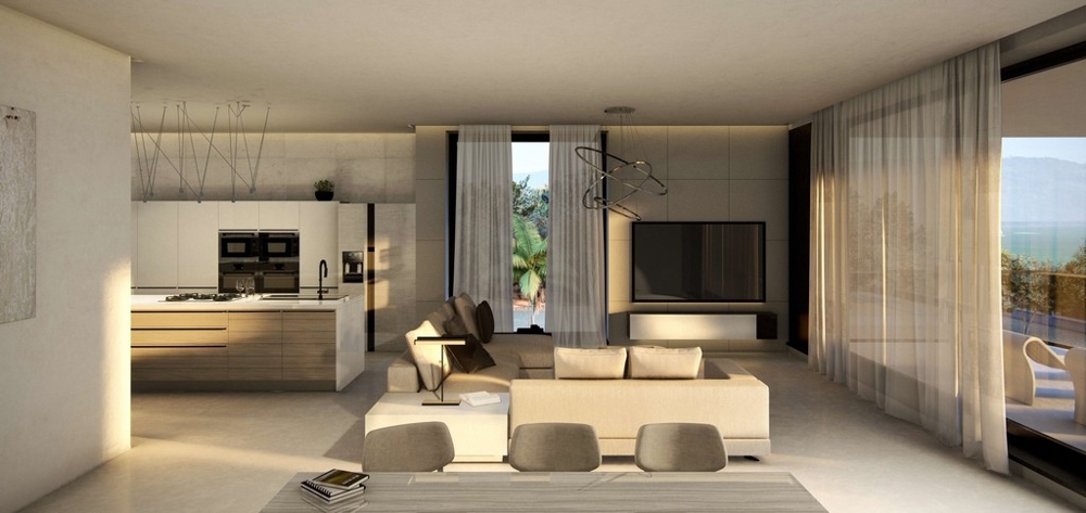 Modernt designat vardagsrum och matplats.