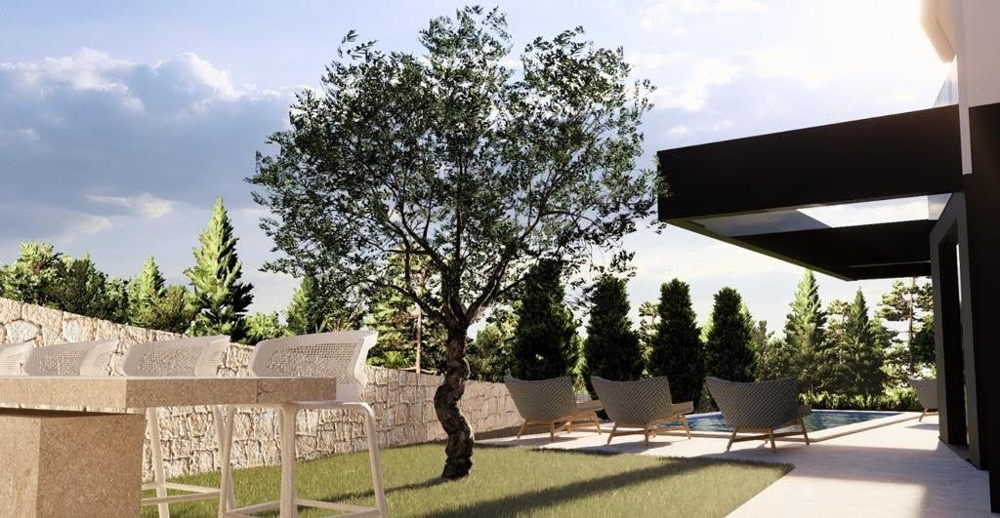 Utomhusavkopplingshörna i en kroatisk lyxvilla med utsikt över välskötta trädgårdar och snygga möbler - Köp en exklusiv lägenhet i Kroatien.