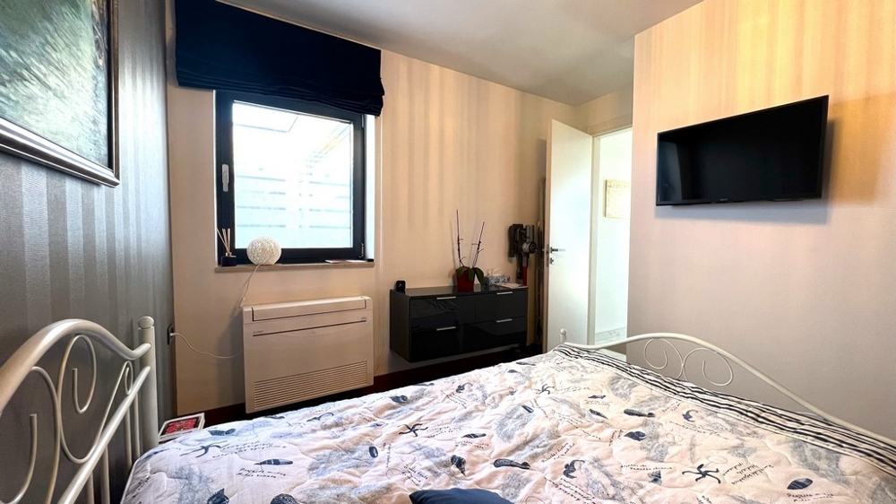 Fastigheter Kroatien, staden Krk, ön Krk Köp lägenhet - sovrum med TV