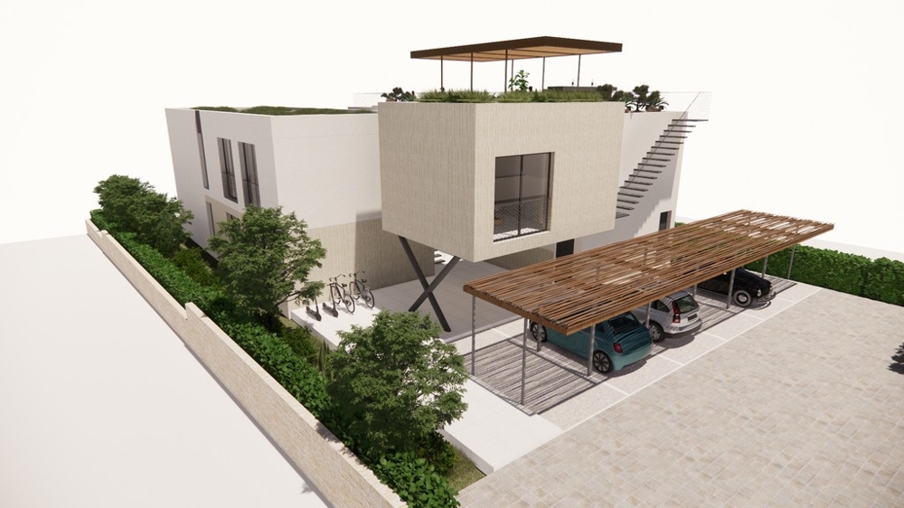 Baksidan av byggnaden med täckt parkering.