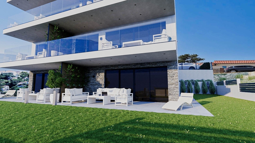 Modern lägenhet med terrass på bottenvåningen.