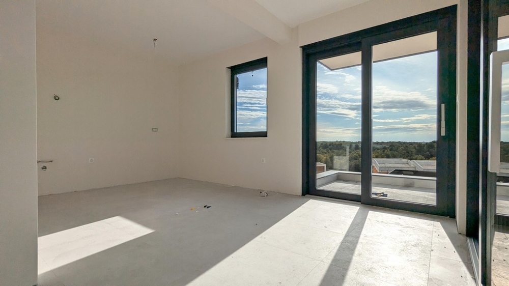 Vardagsrum med tillgång till terrassen till lägenhet A3536 i Istrien.