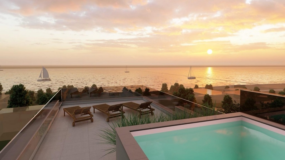 Takterrass med pool och havsutsikt vid solnedgången