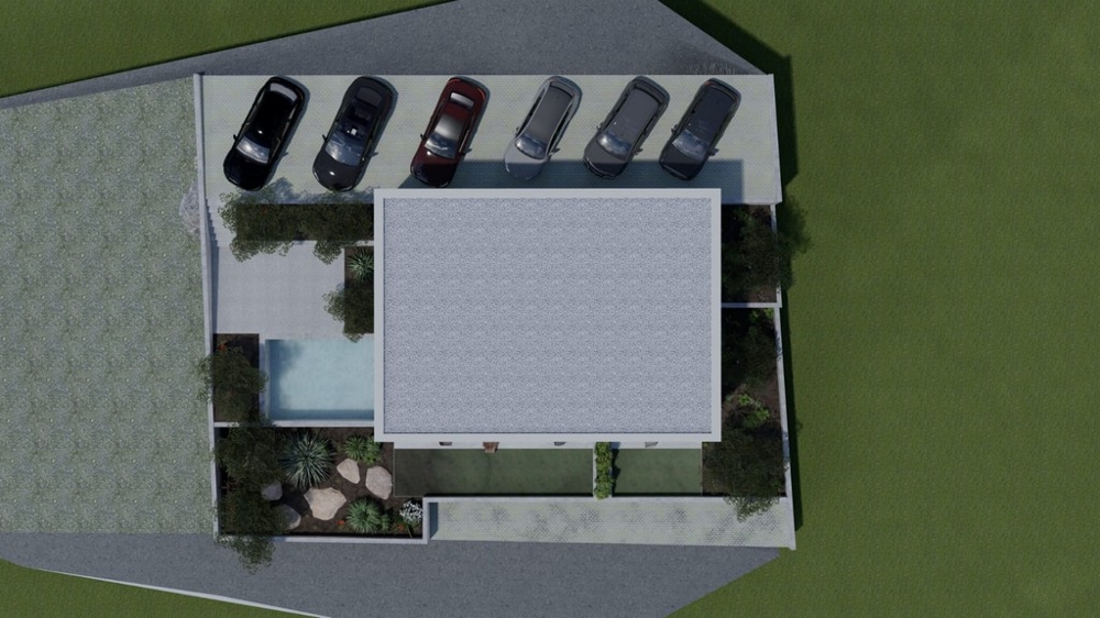 Ovanifrån av bostadshus med parkeringsplatser och pool