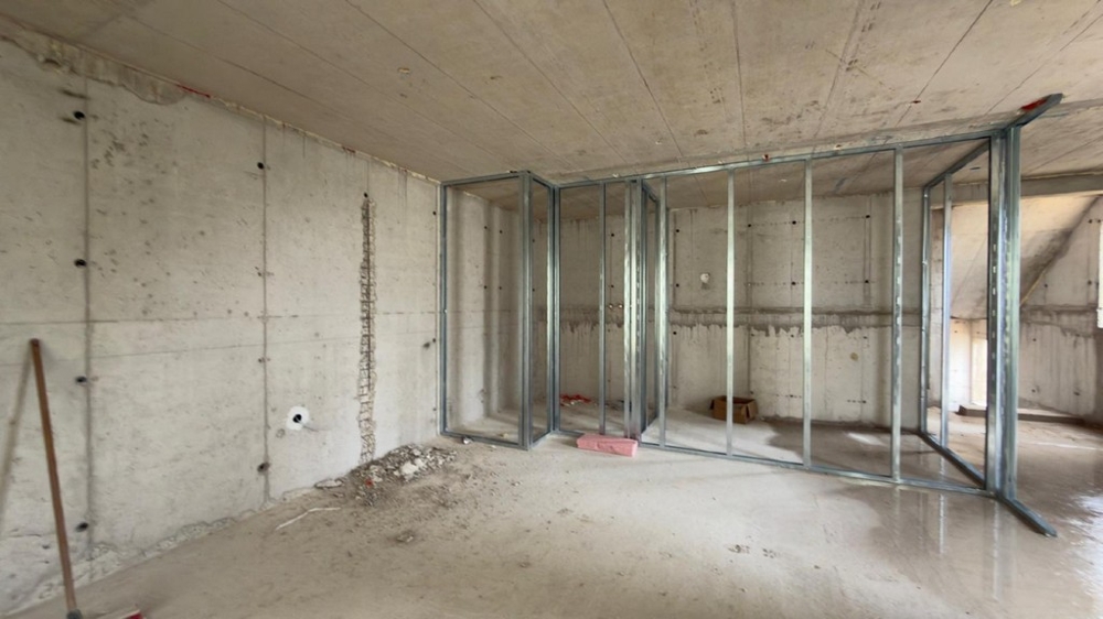 Oavslutat sovrum med gipsväggar