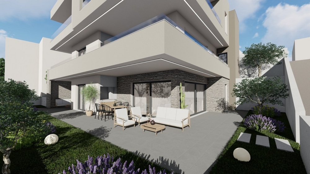 Täckt terrass med loungemöbler och utsikt över landskapet