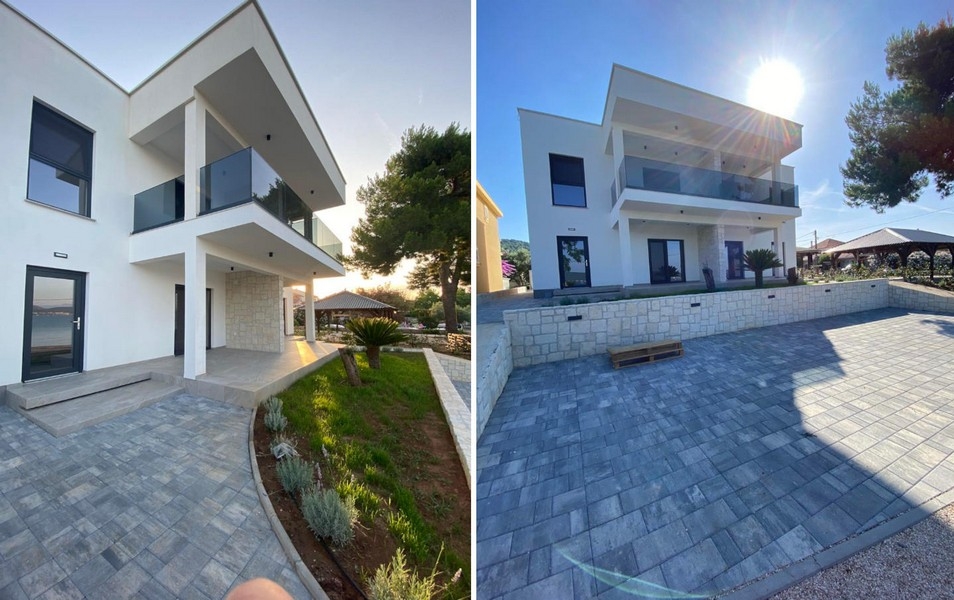 Villa med tillgång och parkeringsplatser framför huset