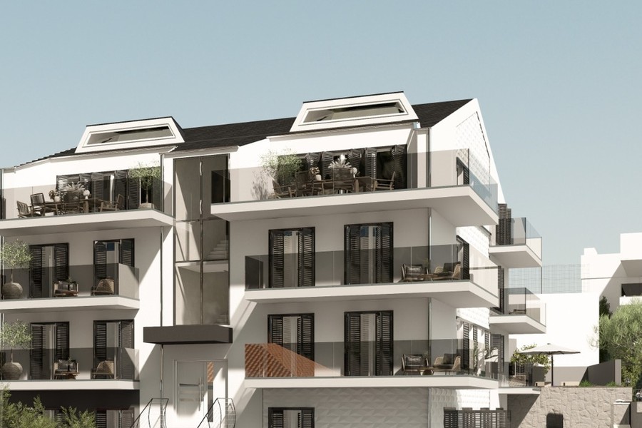 Bostadshus med tre våningar och takkupor