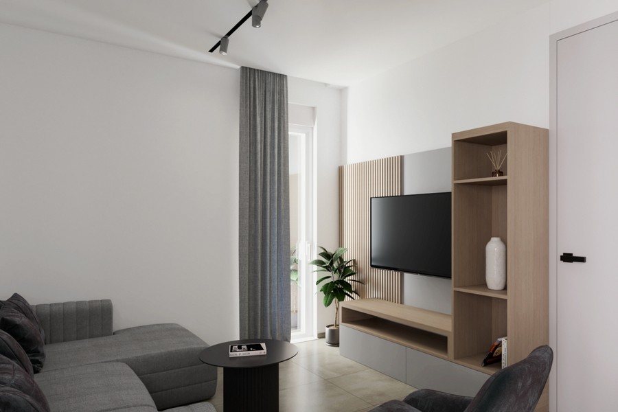 Vardagsrum med TV-vägg och hyllsystem i trä