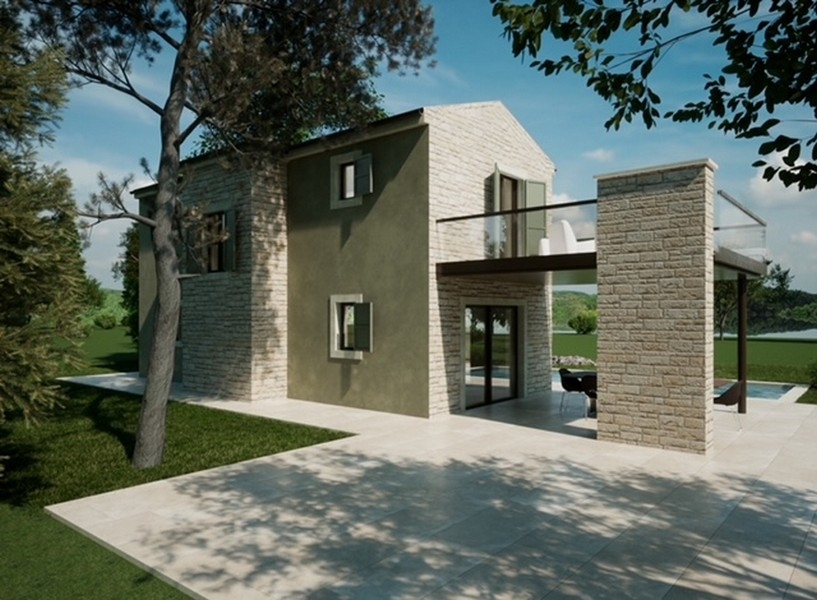 Närbild av en fastighet i Istrien med en grå fasad och röda höstlöv i förgrunden.