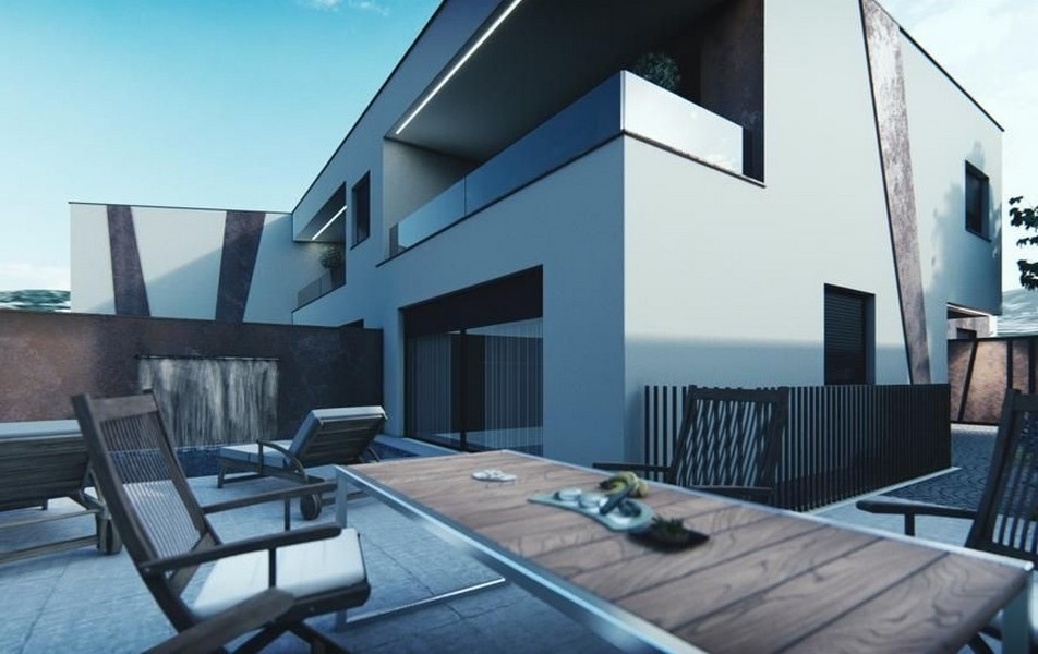 Modernt hus med trädgård och havsutsikt