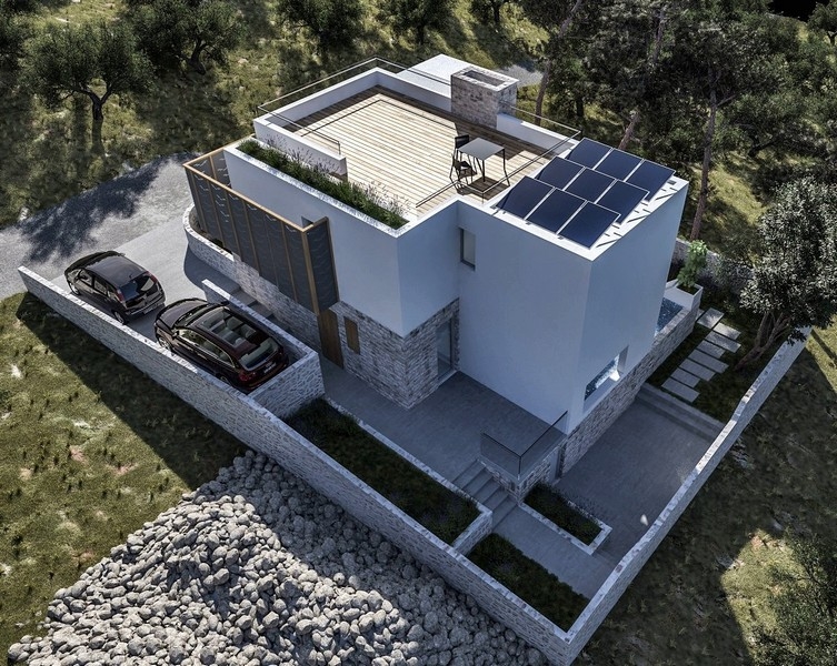 Drönarevy av en nybyggd villa med takterrass och uteplats, till salu i Krk, Kroatien, omgiven av olivträd
