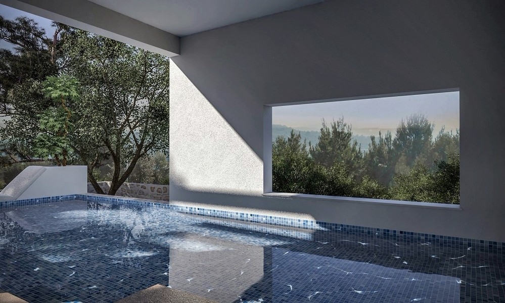 Interiörvy av en täckt pool med havsutsikt i en villa till salu i Jezera, Murter, Kroatien