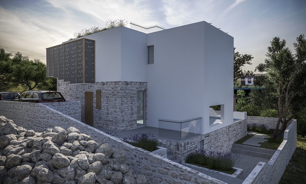 Flygfoto över en modern villa till salu på ön Krk i Kroatien, med två parkerade bilar och solpaneler på taket