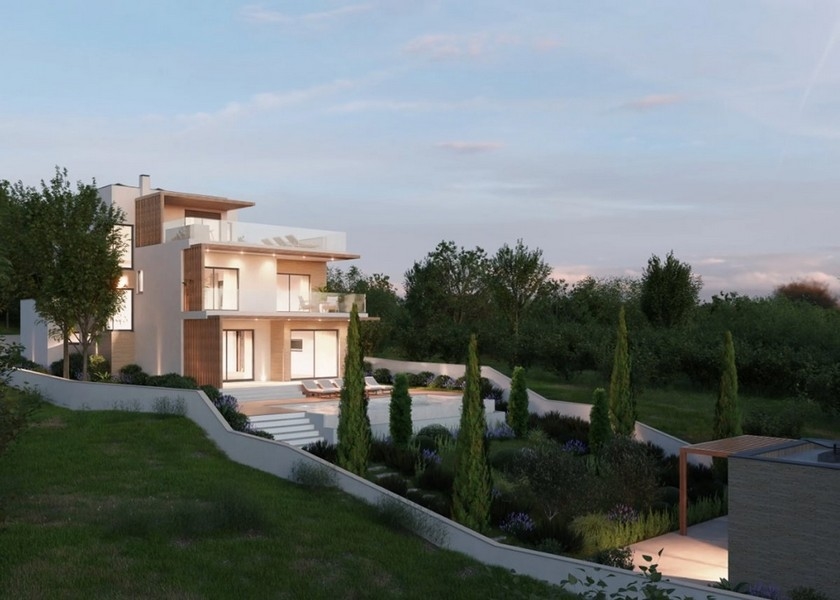 Mysigt vardagsrum med öppen spis i en modern villa i Kroatien, havsutsikt i skymningen