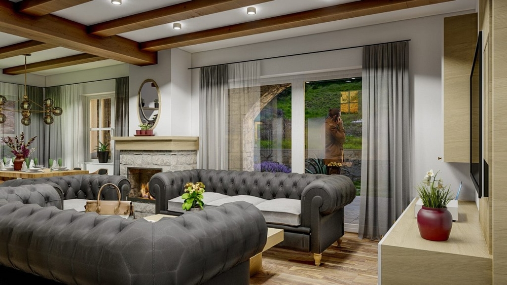 Vardagsrum i en medelhavsvilla med eleganta grå soffor och utsikt över trädgården på ön Krk