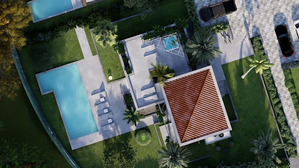 Flygfoto över villa med pool och trädgård