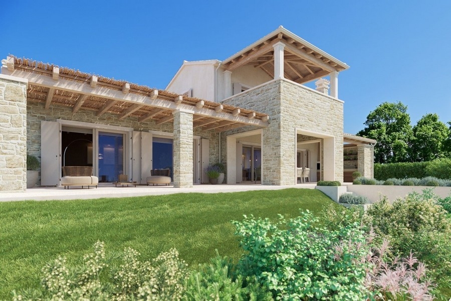 Exteriör vy av lyxvillan med terrass och trädgård