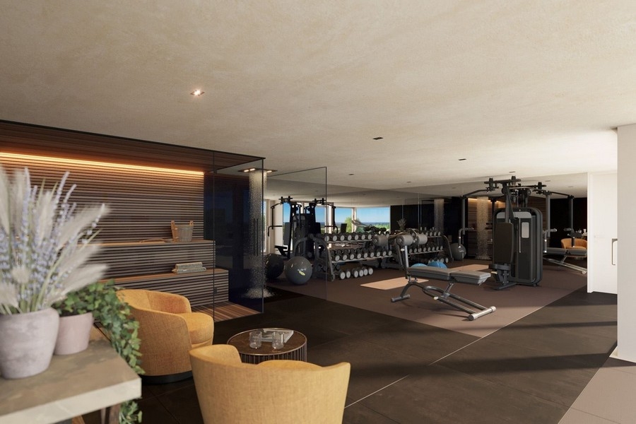 Fitnessrum med modern utrustning och bastu