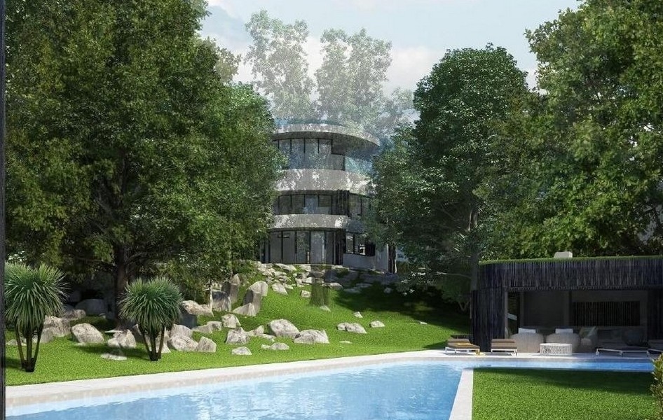 Lyxig villa med cirkulär design, pool och grönt landskap