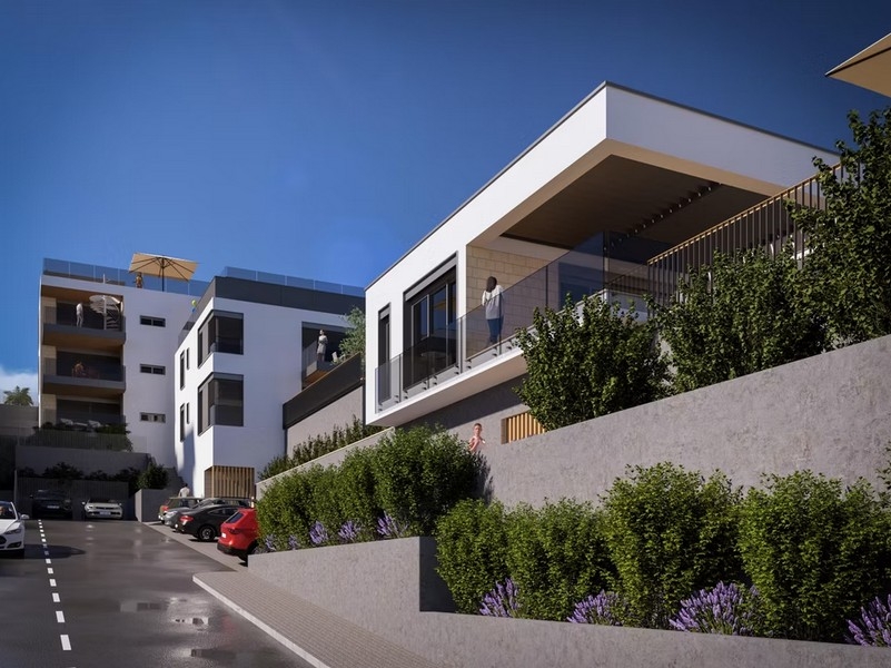 Bostadskomplex med moderna byggnader på en sluttning