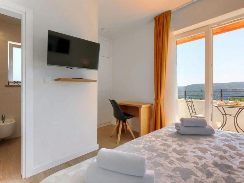 Sovrum med tillgång till balkong och havsutsikt