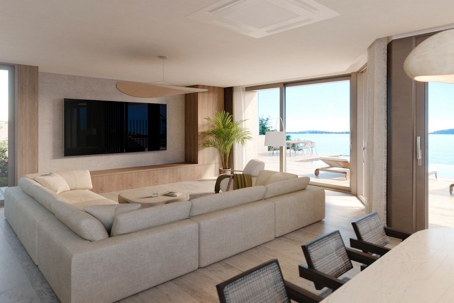 Vardagsrum med terrass och havsutsikt i modern villa
