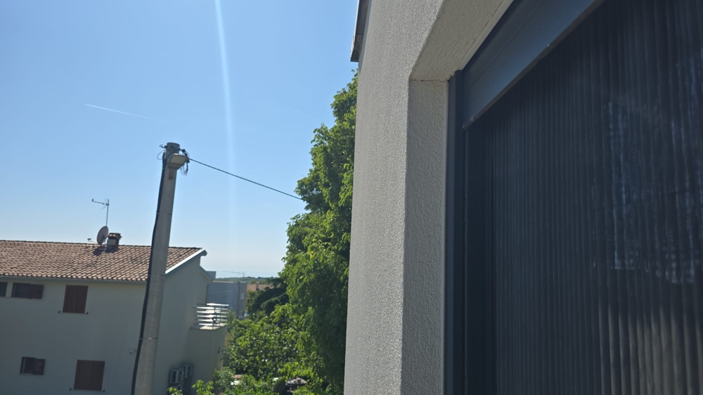 Terrass med pergola och utsikt över landskapet