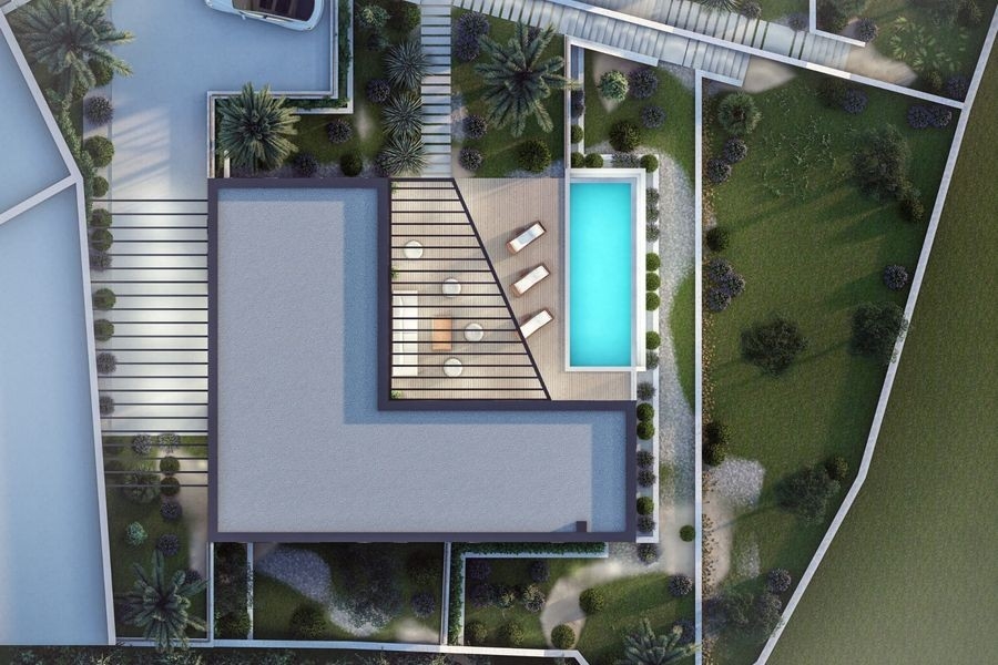 Exteriör vy av villan med stora fönsterfronter