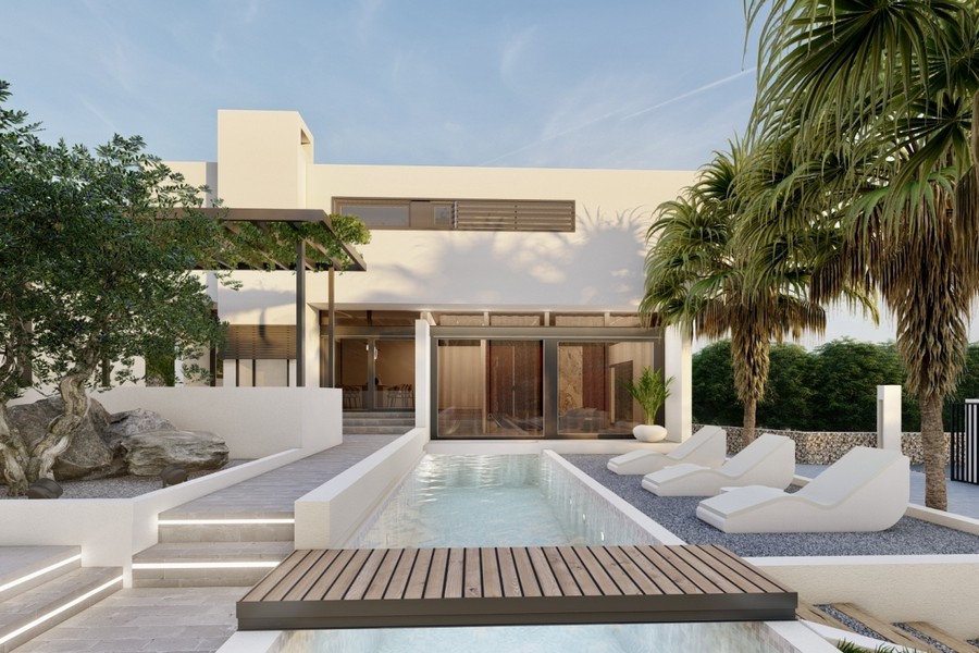 Villa med pool och stora glasfronter mot trädgården