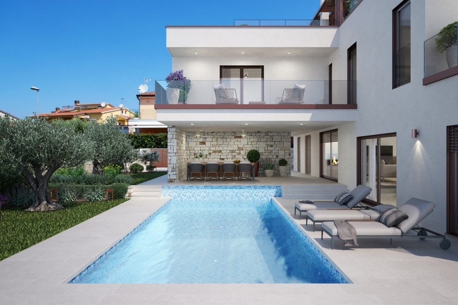 Pool med solstolar framför villan i Novigrad