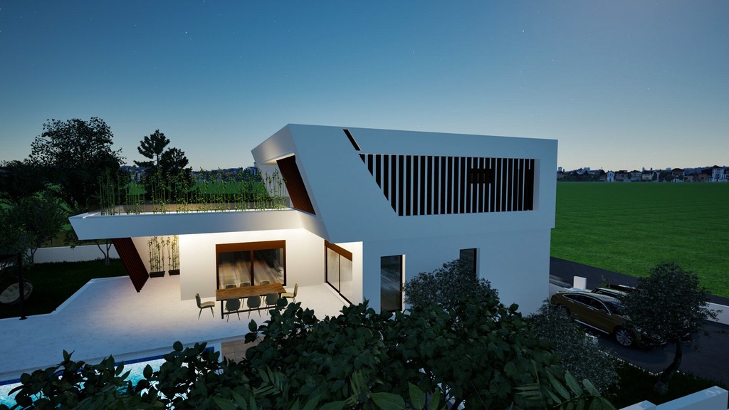 Villa på kvällen med upplyst terrass